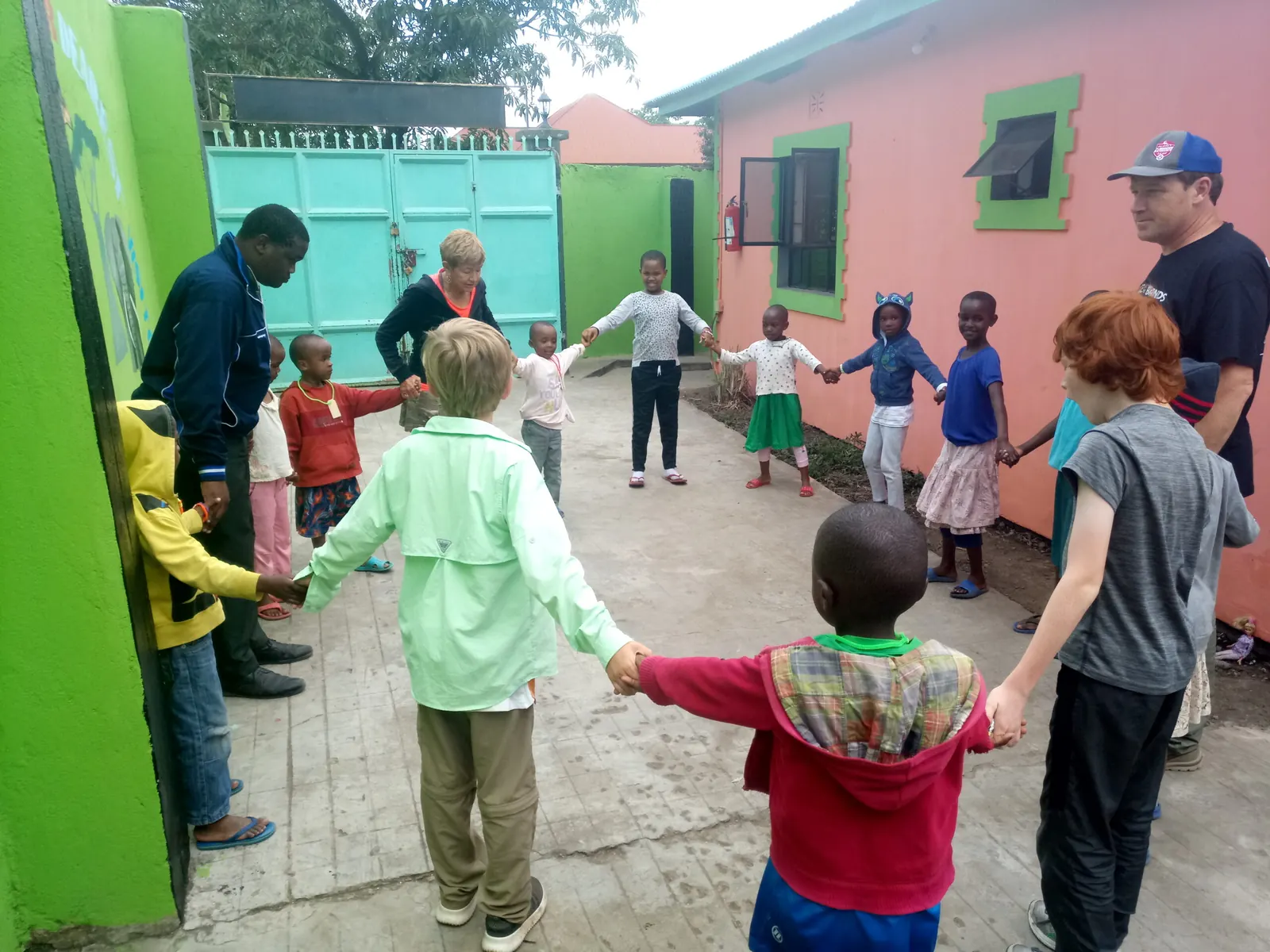 Fortune Kids team and children during a community activity in Arusha