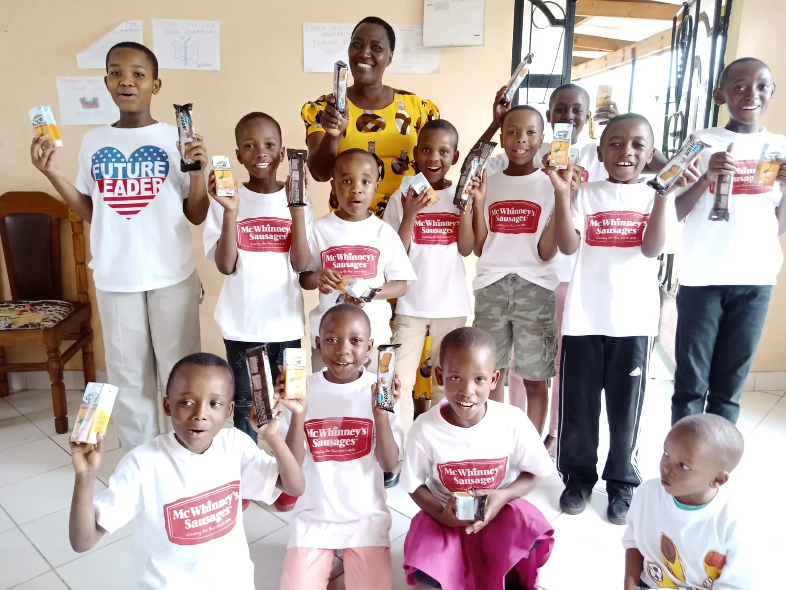 Children smiling during a Fortune Kids educational activity in Arusha